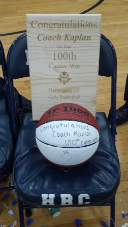 Mike Kaplan was presented with a special basketball and carved wooden plaque.