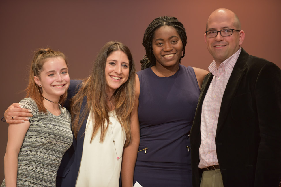 Camryn Libes (left) and Hannah Baptiste (second from right) with Brett Saltzman's family