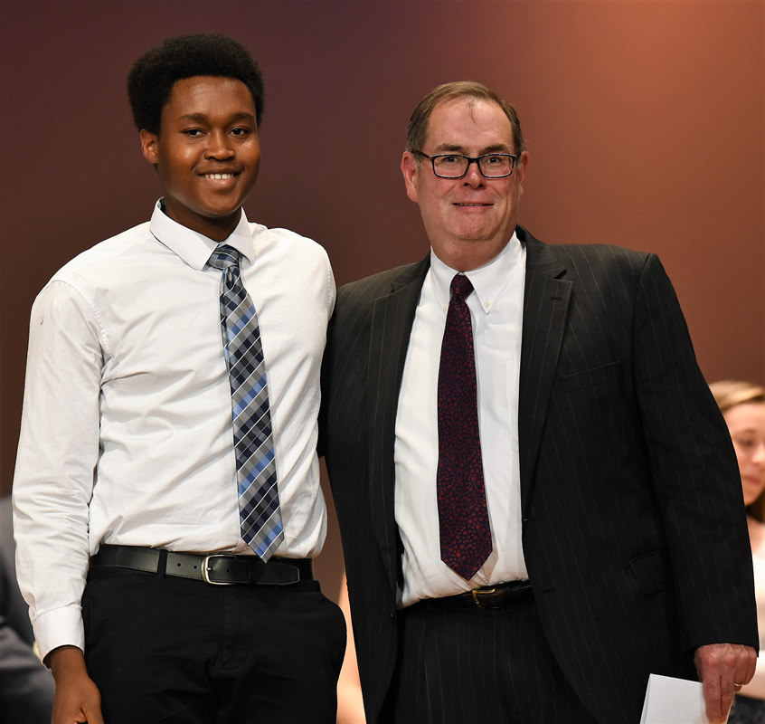 Klibensky Petit-Frere with the Rotary Club's Robert Bishop