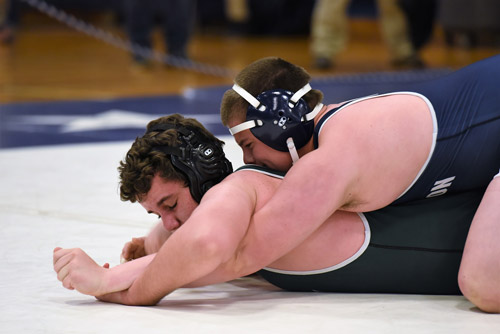 Huntington sophomore Chas Forte smothers his opponent.