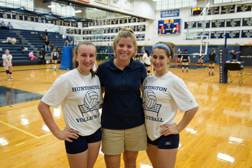 Huntington JV volleyball coach Carrie Postel is flanked by Peyton Kalk and Steli Vlahos. 