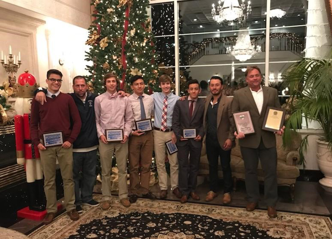 Huntington boys' soccer coaches and players at the Suffolk banquet.