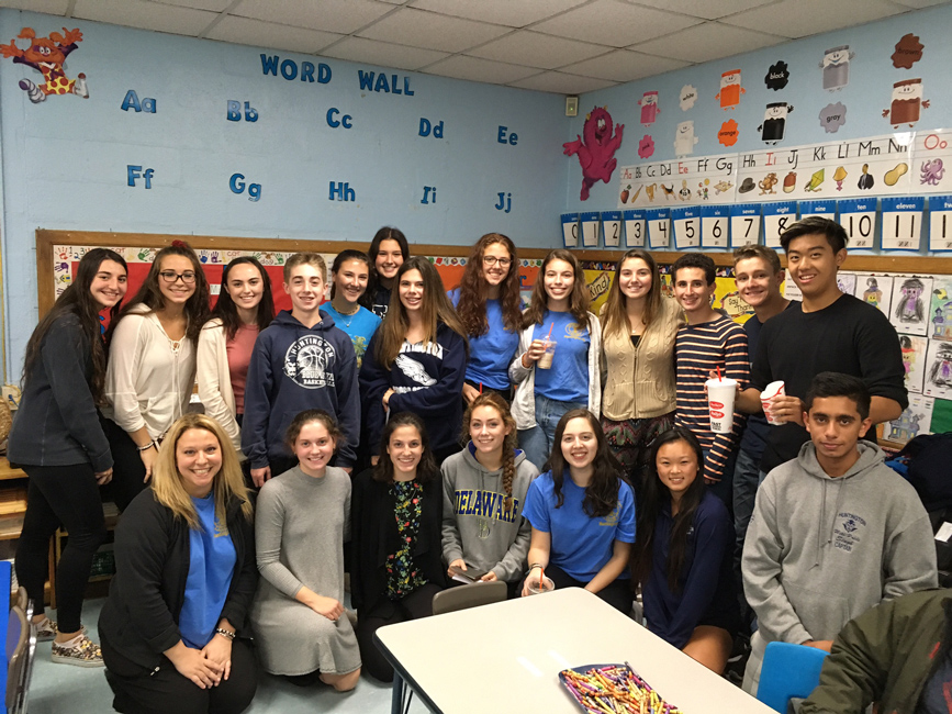 Huntington High School Interact Club members collaborated with Washigton School students on a project.