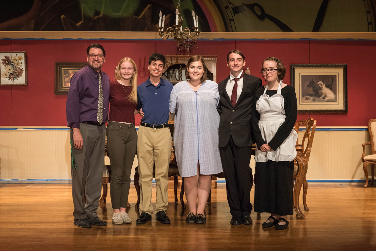 Huntington drama club faculty advisor Michael Schwendemann with the five seniors from the group's fall production. 