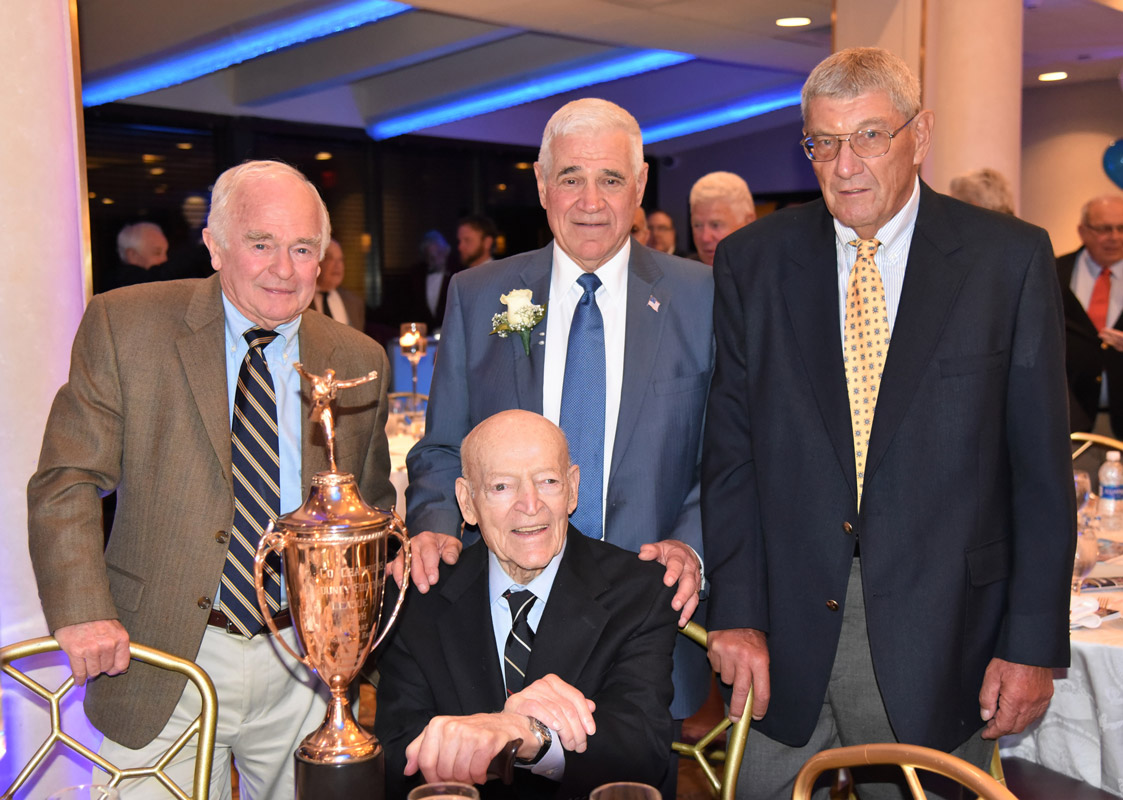 Jerry Asher (back center) his high school coach Al Donofrio and two teammates.