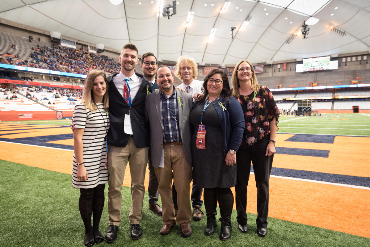 Brian Stellato (front row center) with the Blue Devil band's professional staff. 