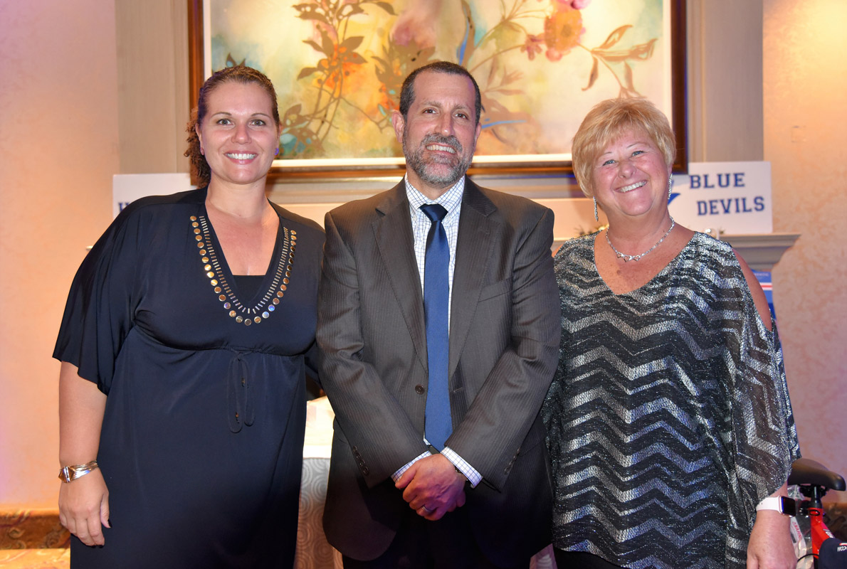 Superintendent Jim Polansky is flanked by Assistant Superintendents Beth McCoy and Kathie Acker.