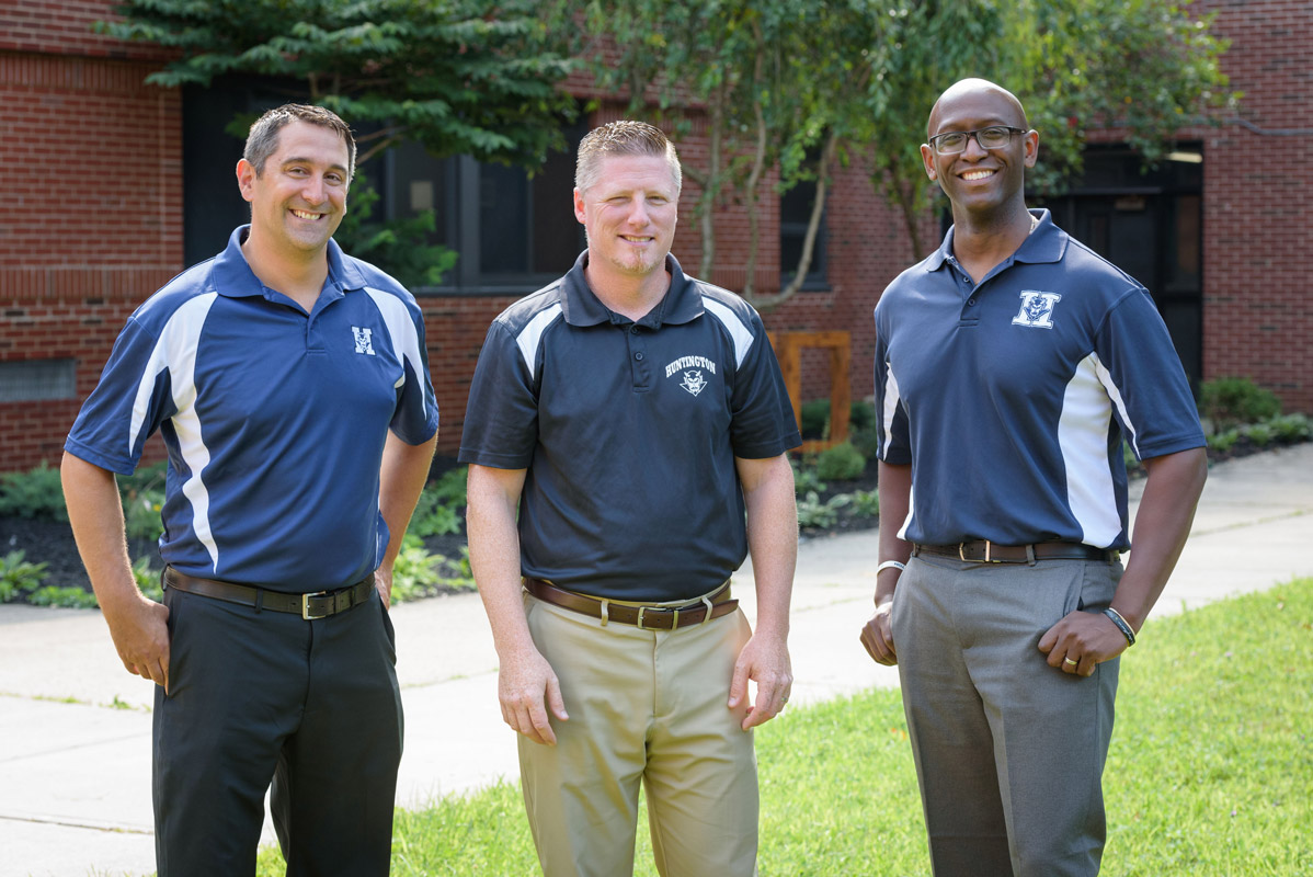 Brenden Cusack is flanked by Asst. Principals Gamal Smith and Joe DiTroia