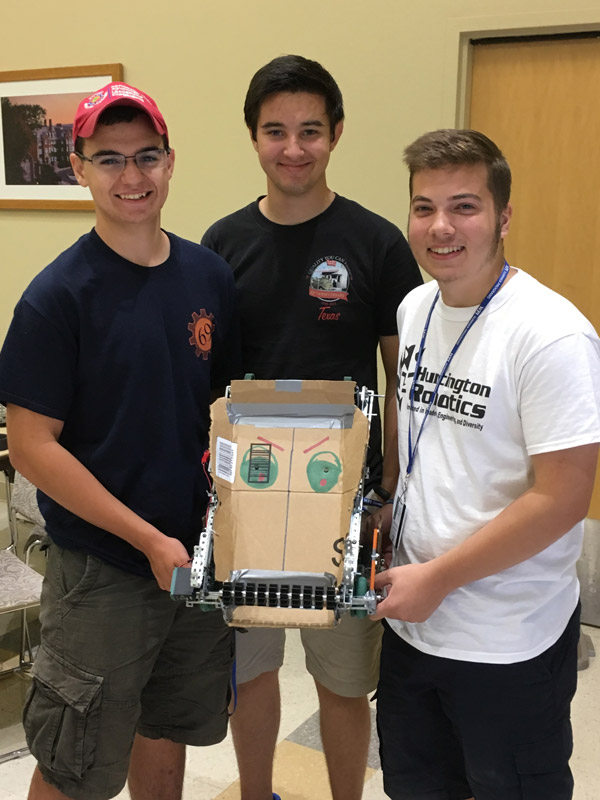 John Riley (right) with his teammates at WPI