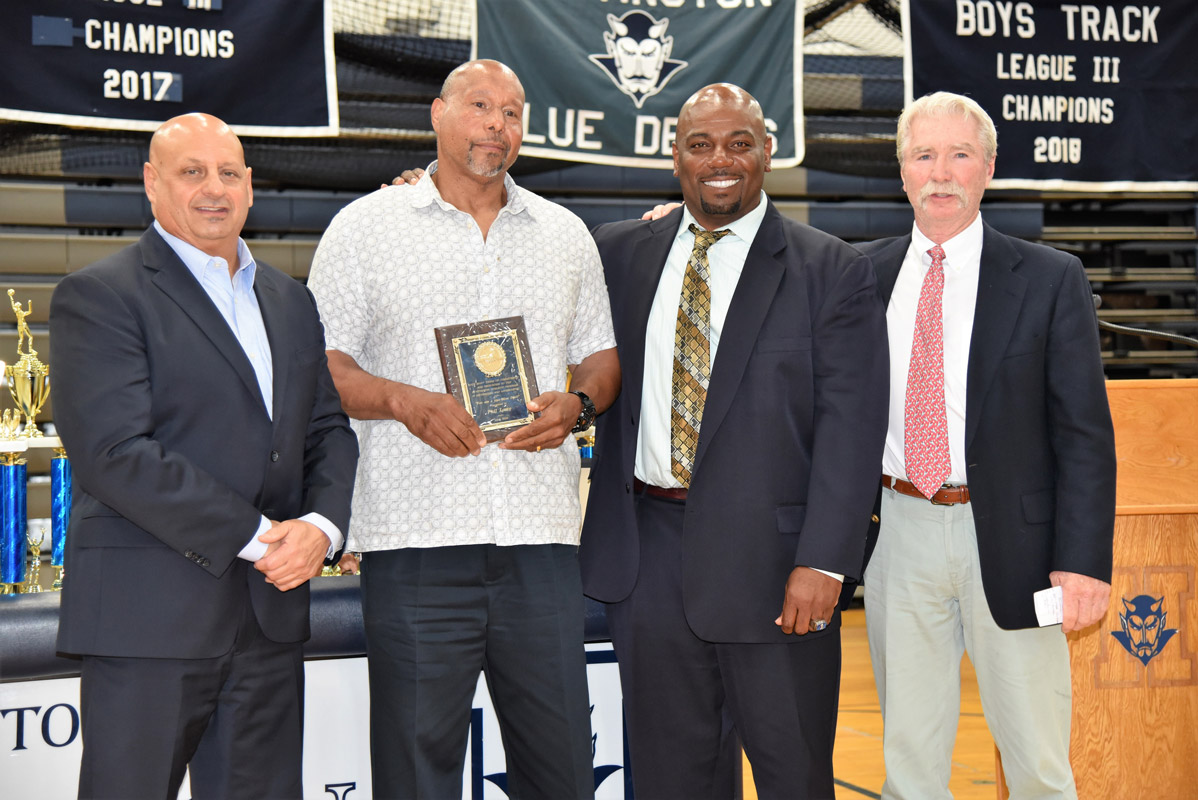 Phil Lowe (holding plaque) with fellow Huntington coaches Steve Muller, Ron Wilson and Brian Carey