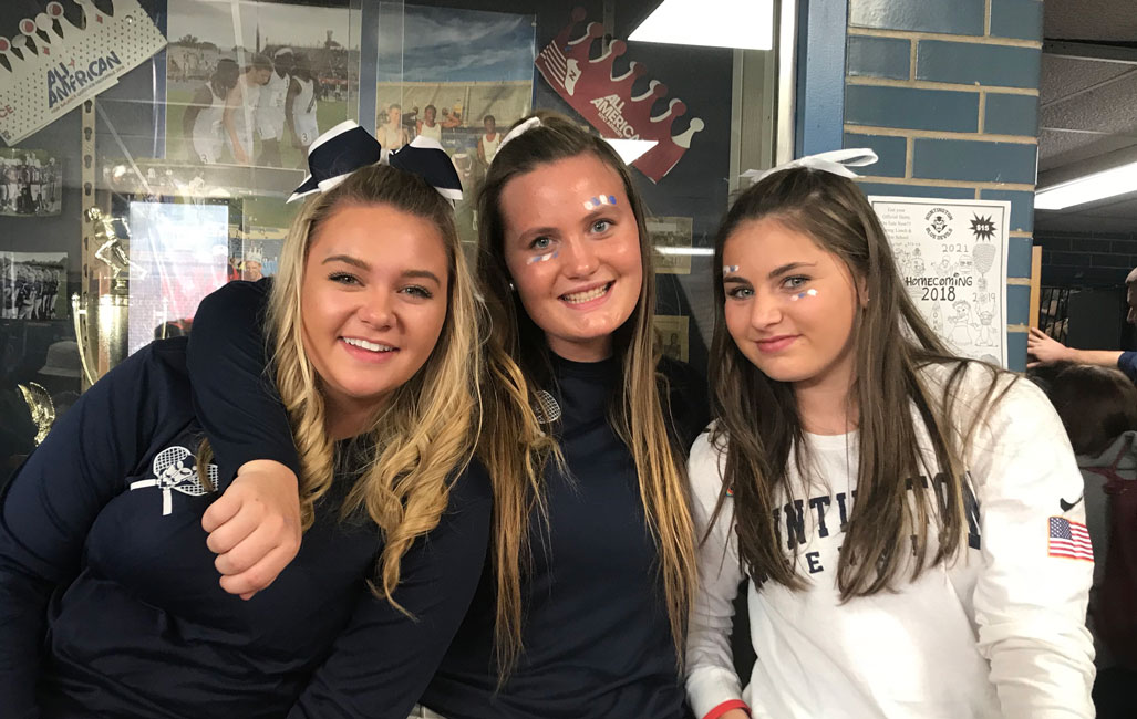 Maire Brown is flanked by tennis teammates Christie Baade and Mia Breitbarth.