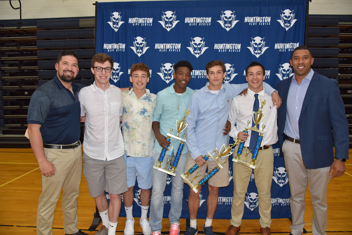 Huntington boys' lacrosse coaches Andrew Gutierrez and Julian Watts with their top seniors 