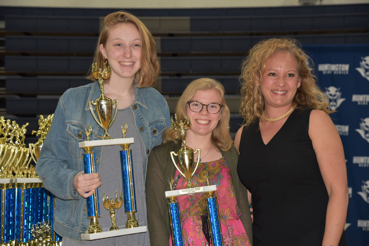 Huntington crew team coach Shawn Dunn with senior award recipients Kelly Warren and Emma Farrell