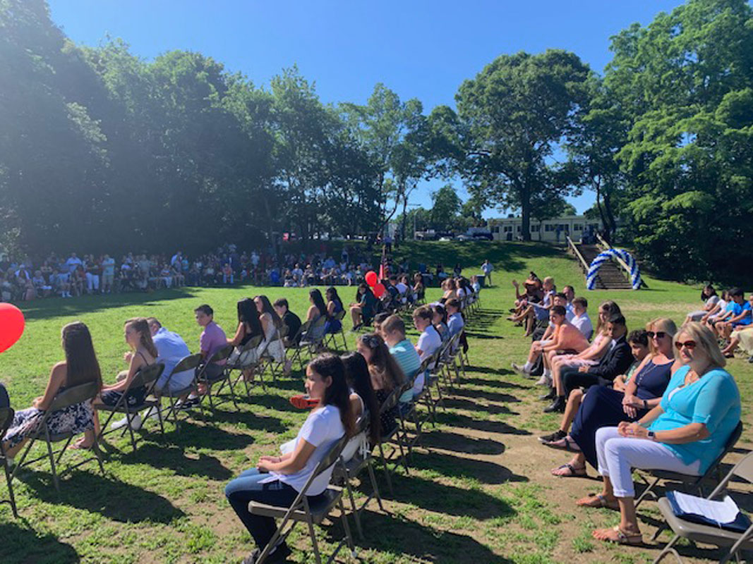 Woodhull School's sixth grade moving up ceremony was held outside on the lower athletic field.  