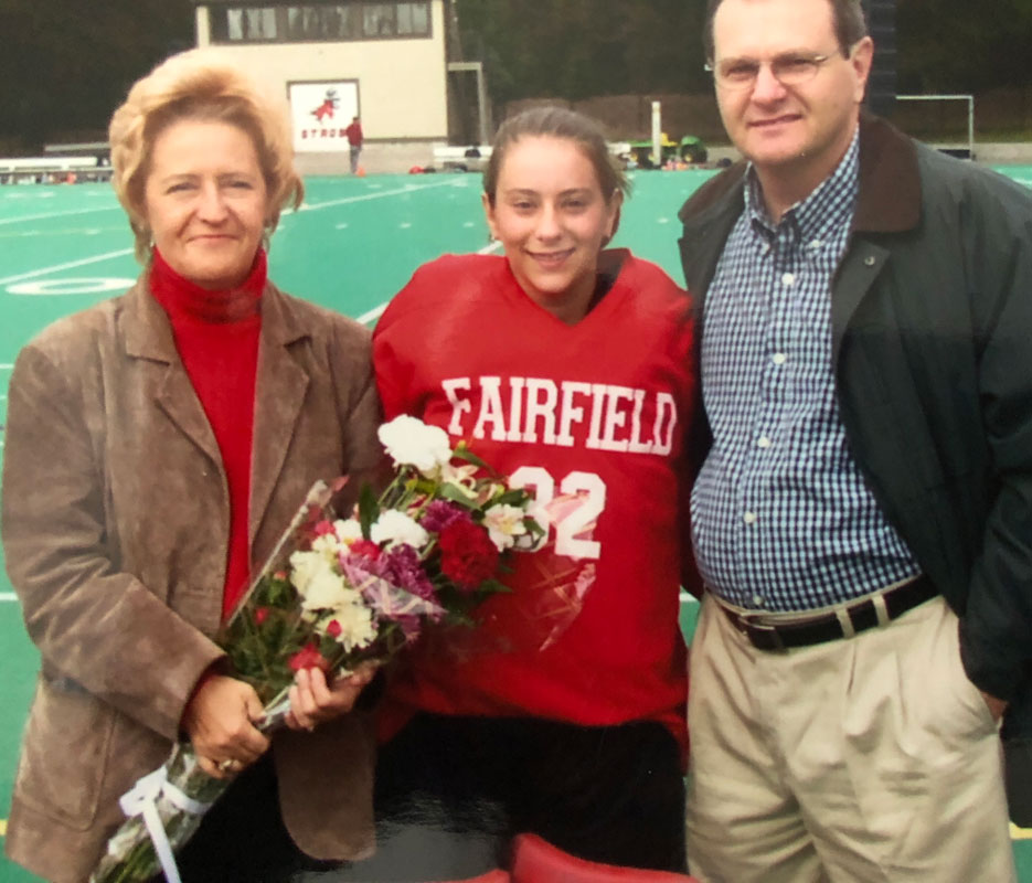 Lauren Thomas-Desiderio with her parents on Fairfield's field hockey Senior Day in 2003.