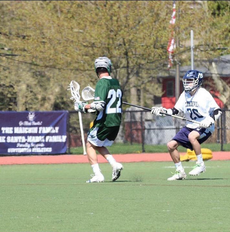 Charlie O'Rourke is on the ball for Huntington varsity boys' lacrosse.