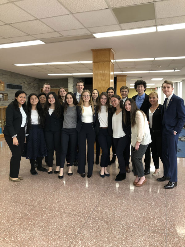  The Huntington mock trial team in the high school lobby prepares to leave for its match at Commack. 