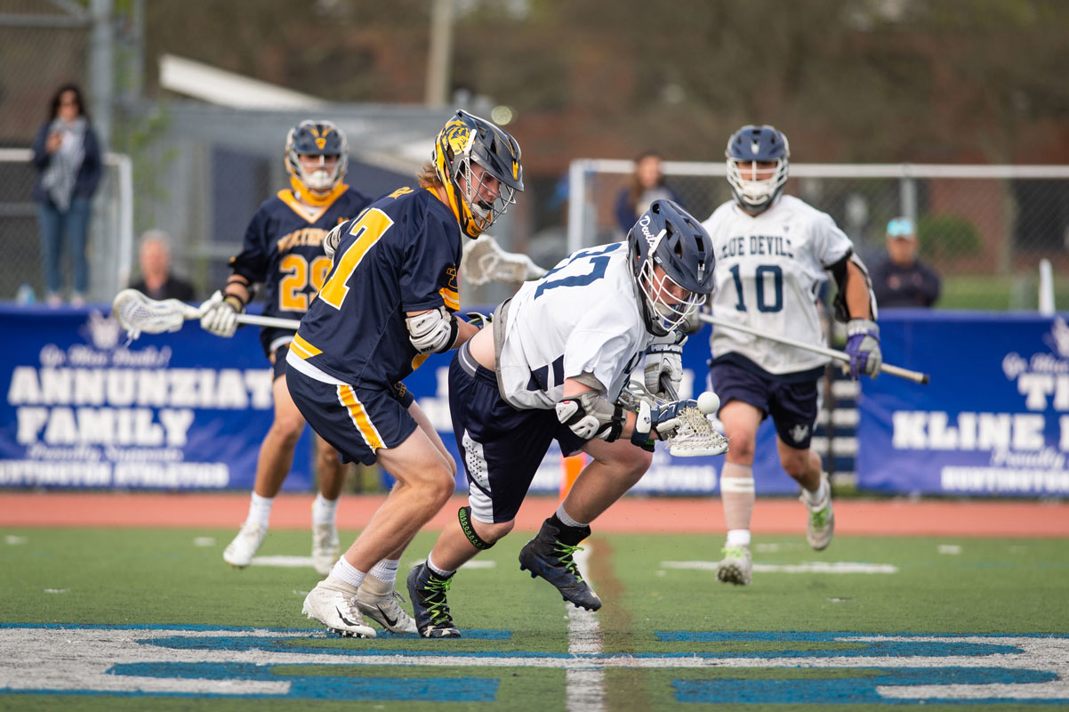 Robbie Smith comes up with the ball for Huntington last spring. (Darin Reed photo.)