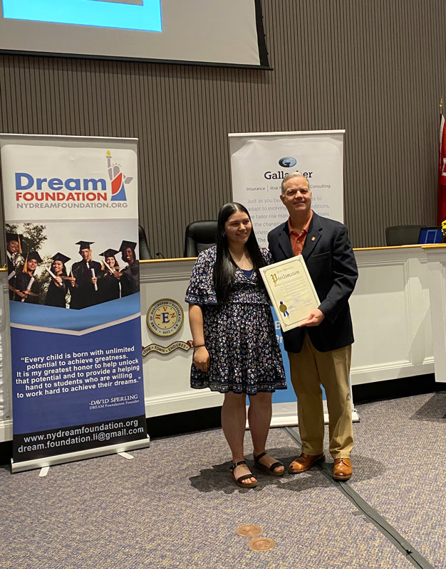  Supervisor Ed Smith with scholarship award recipient Evelyn Benitez. 