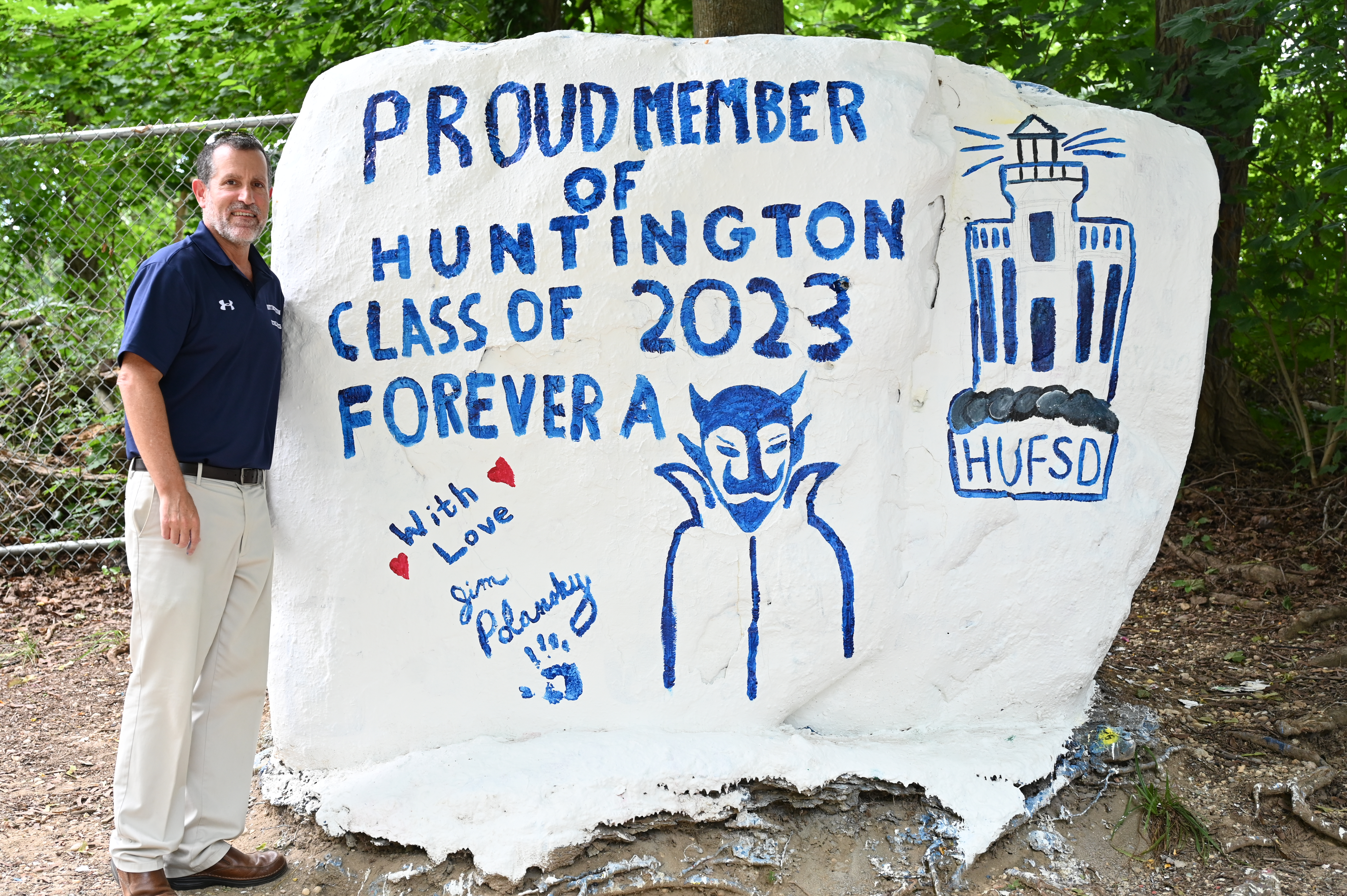  Superintendent James W. Polansky stands at The Rock following the painting of a heartfelt message  