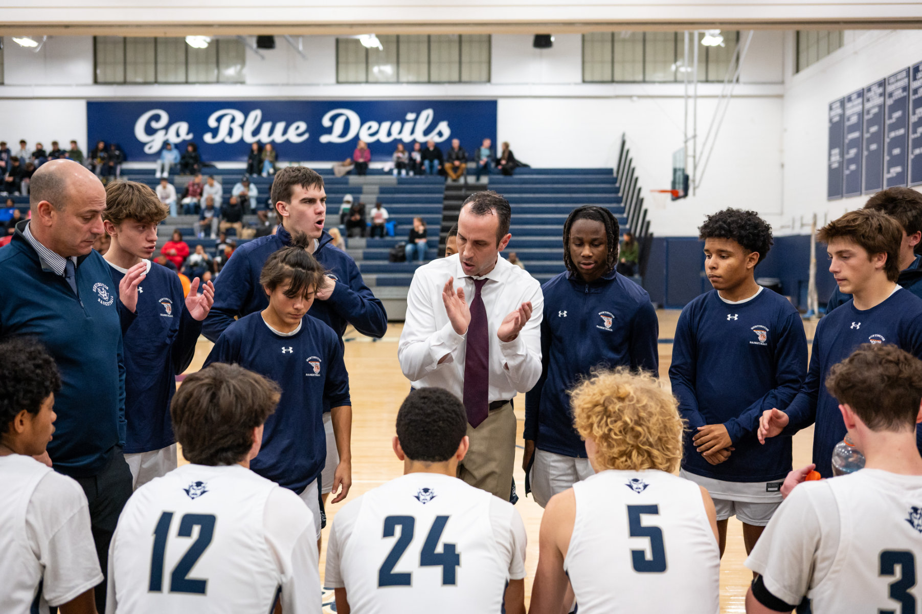  Huntington head coach Peter Lipka rallies his troops last Saturday. (Darin Reed photo.)  