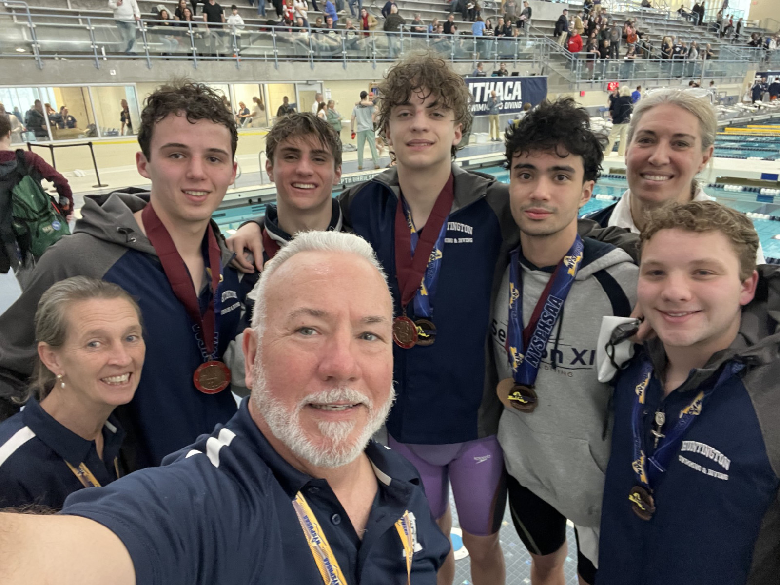  The Huntington coaches and swimmers pose for a selfie.  