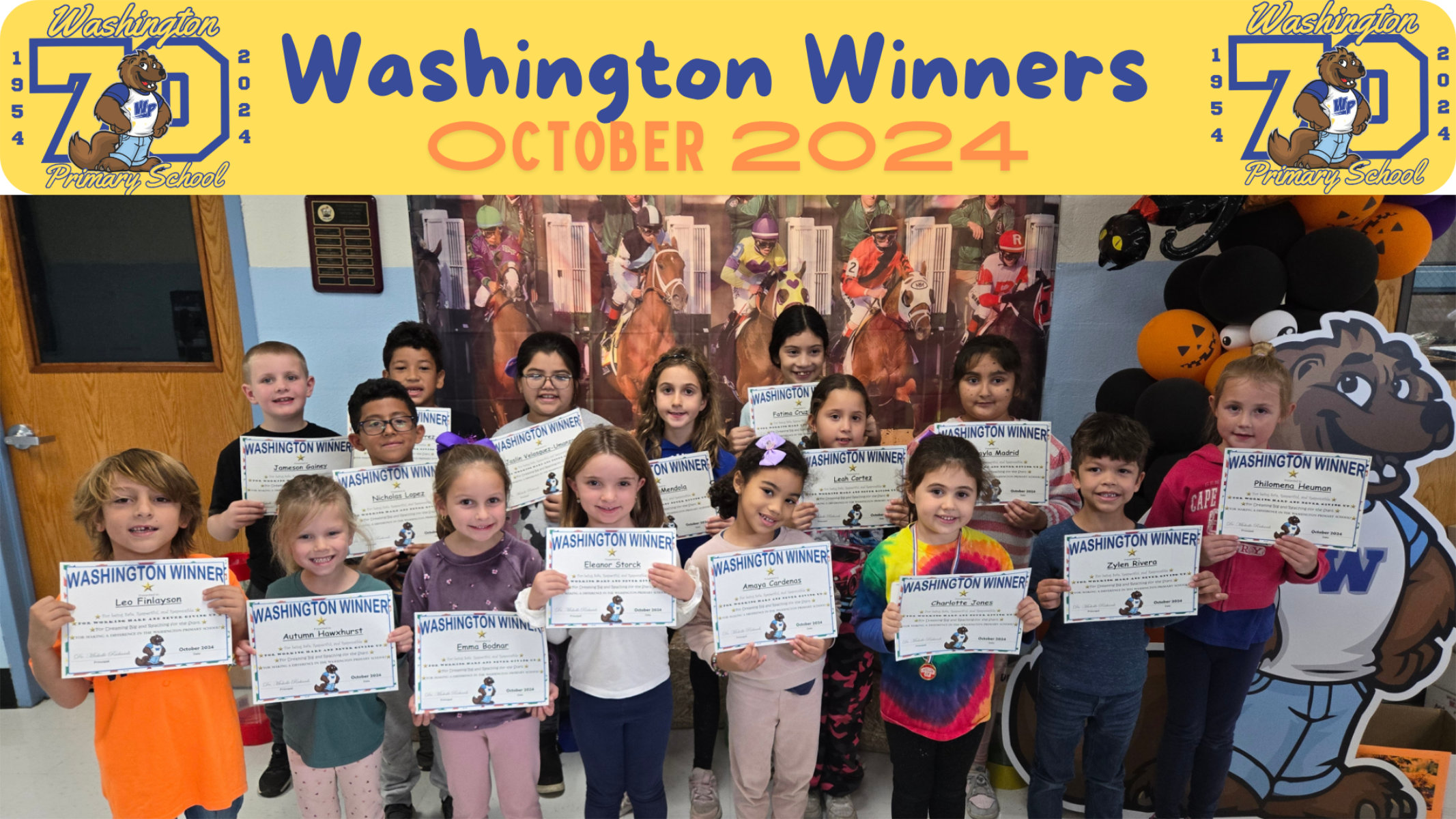  October's top students at Washington Primary School proudly hold their certificates.   