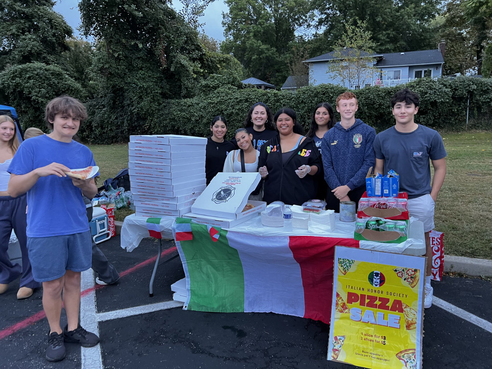  Italian Honor Society members manned a booth at the Homecoming Festival bonfire.    