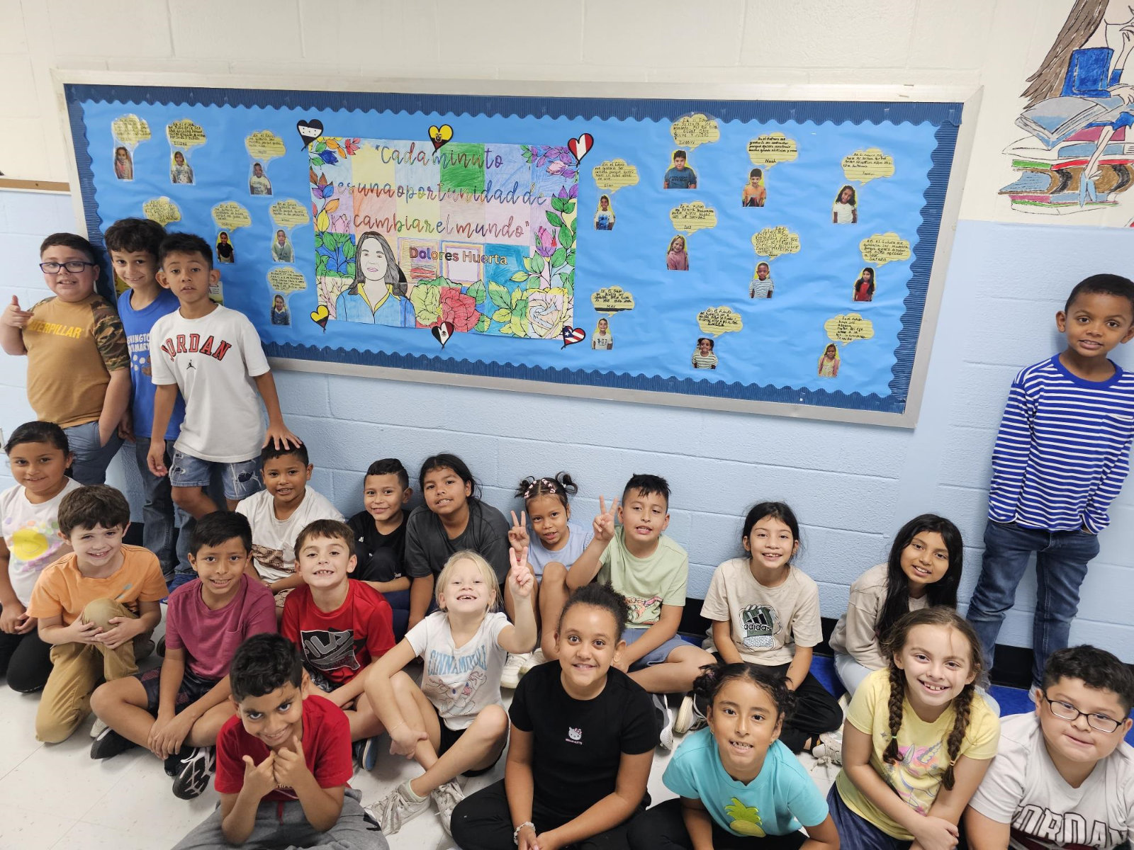  The third graders near the bulletin board honoring Dolores Huerta.