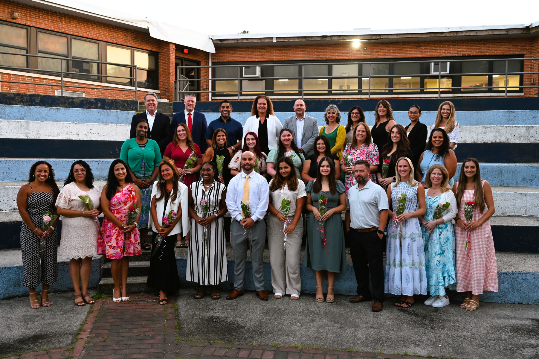 Huntington's administrator and school board with the 20 newly tenured faculty members (1)