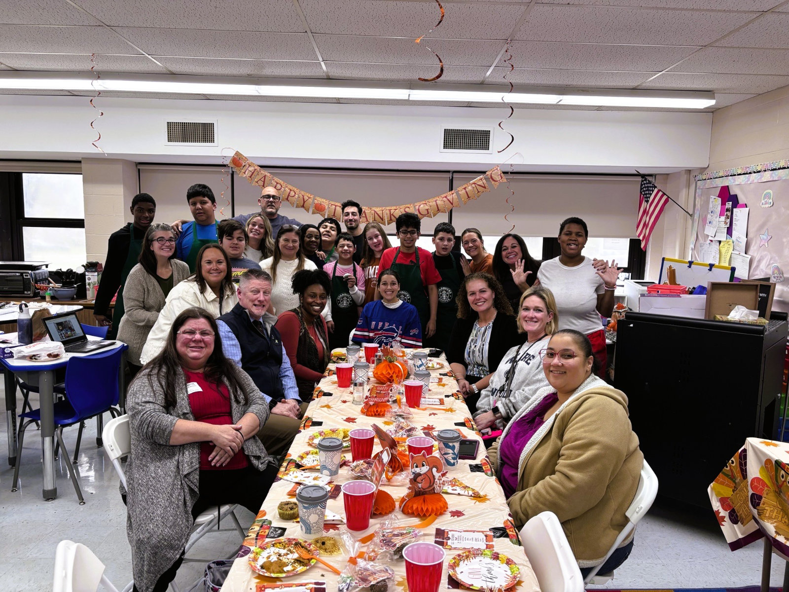  The luncheon guests sit down for a Thanksgiving feast.