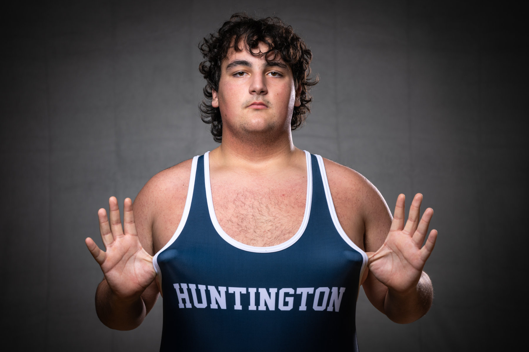  Huntington's Ethan Naima notched a crucial pin last Friday night to lift Huntington. (Darin Reed photo.)  