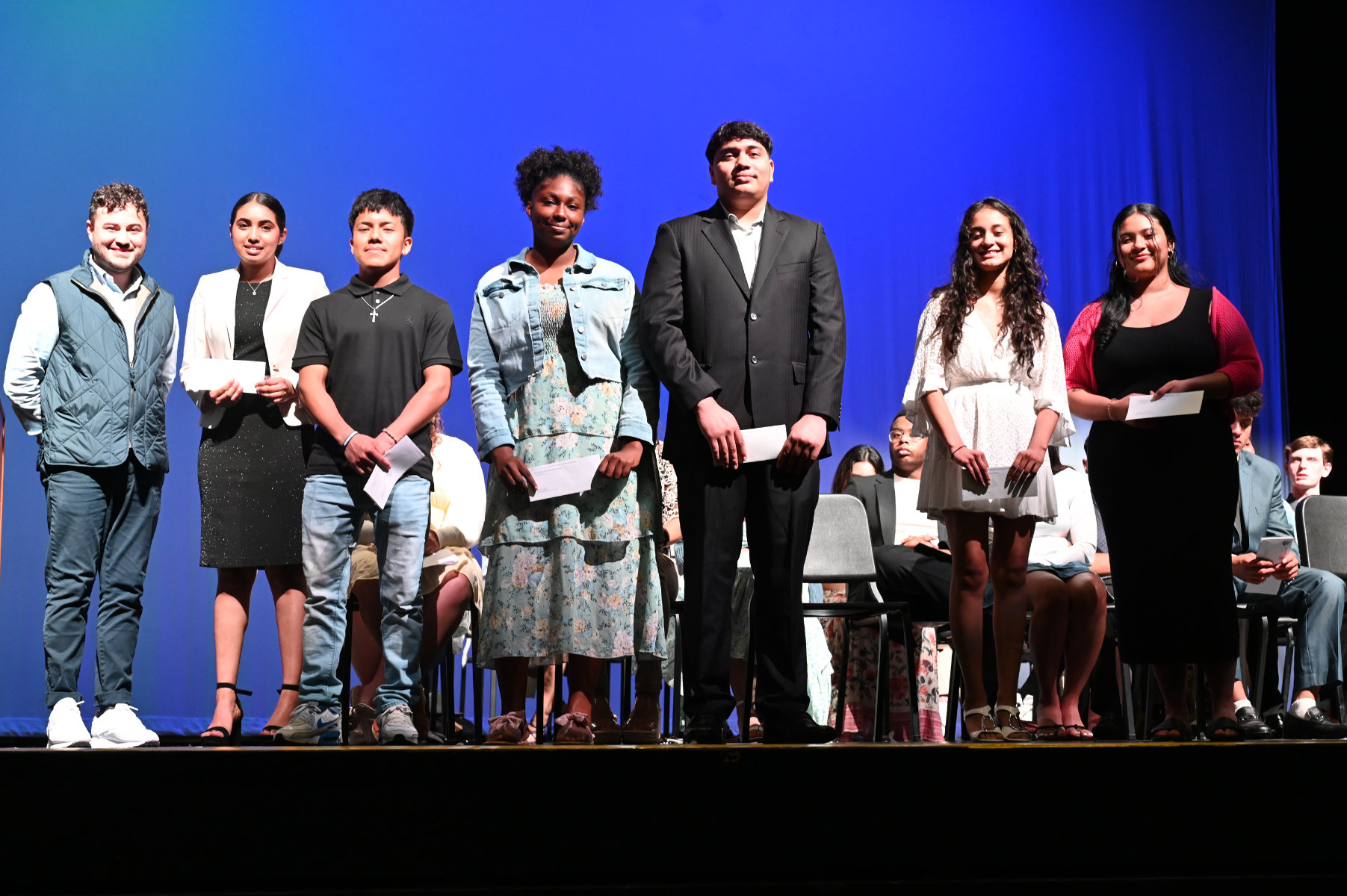 New World Club scholarship award recipients with faculty advisor Marlo Romero (left)