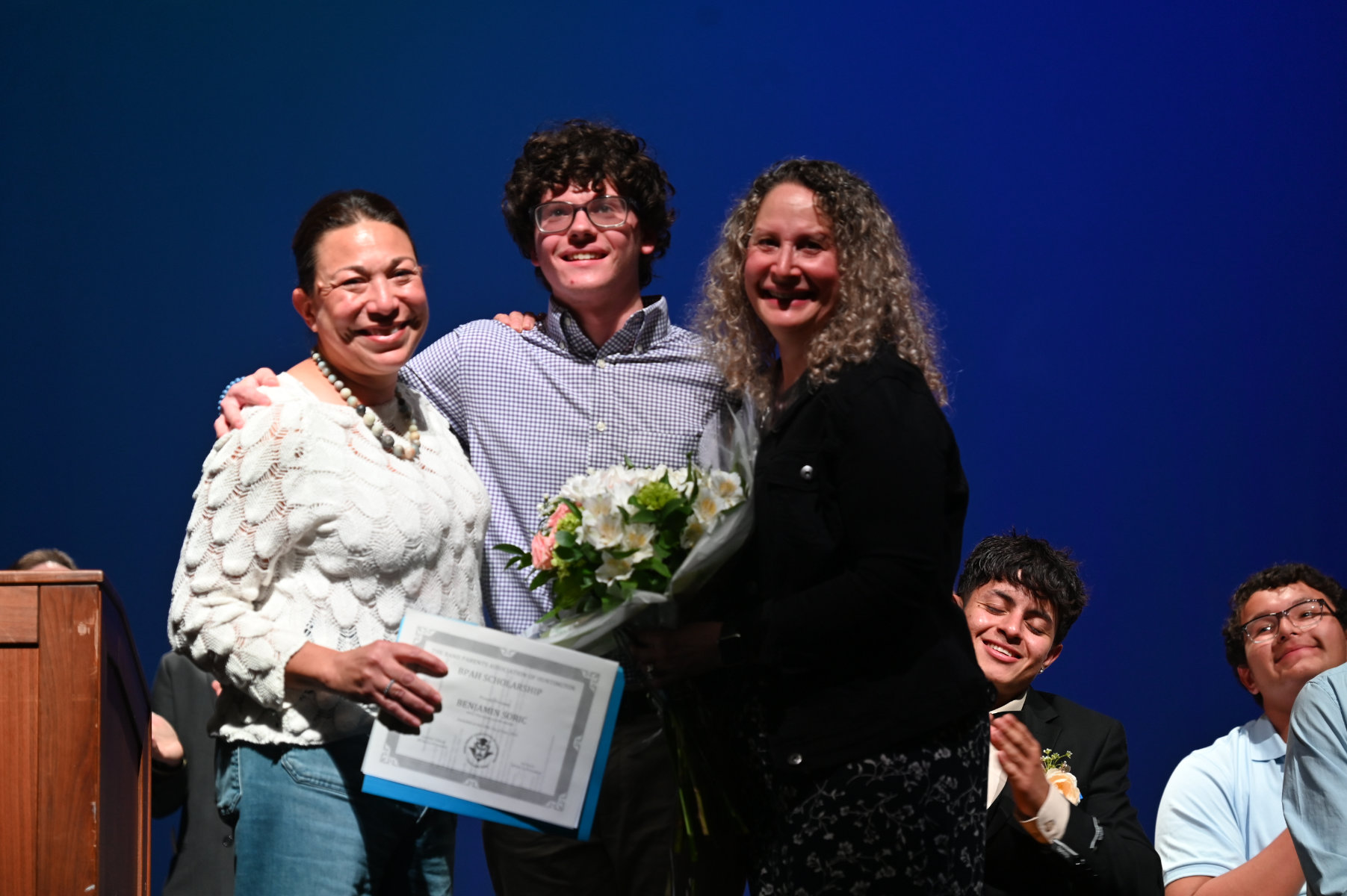 Benjamin Soric is flanked by BPAH officials Arienne Lima and Ivy Soric