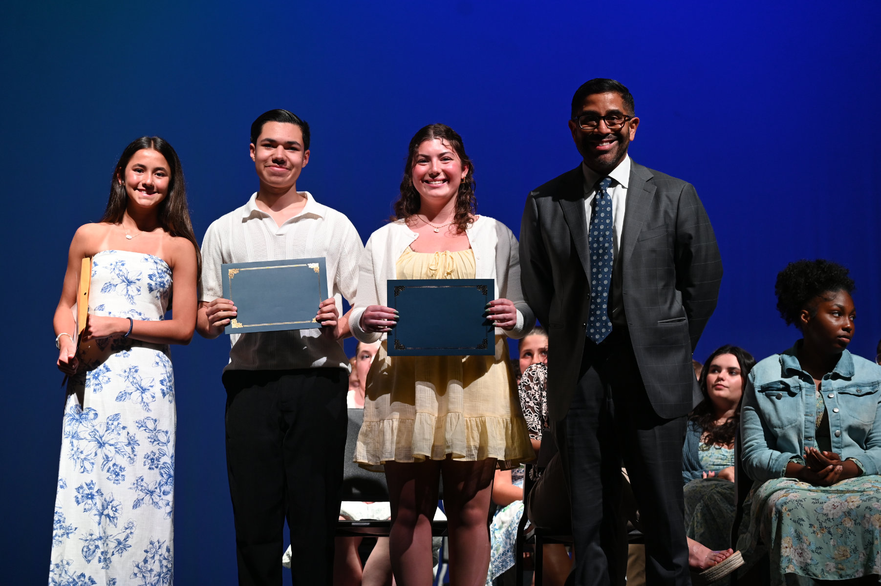 Violet and Xavier Palacios flank Nina Fascilla and Iverson Menjivar Quintanilla