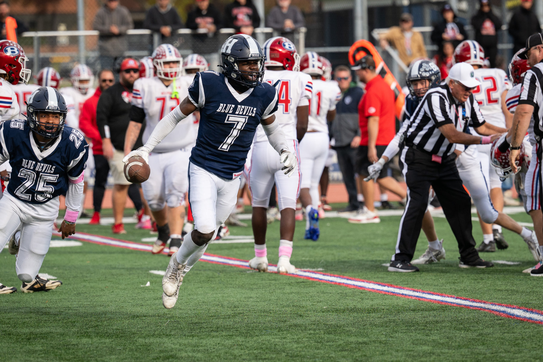  Senior Titan Elysee (No. 7) is vying for All-State honors. (Darin Reed photo.)  