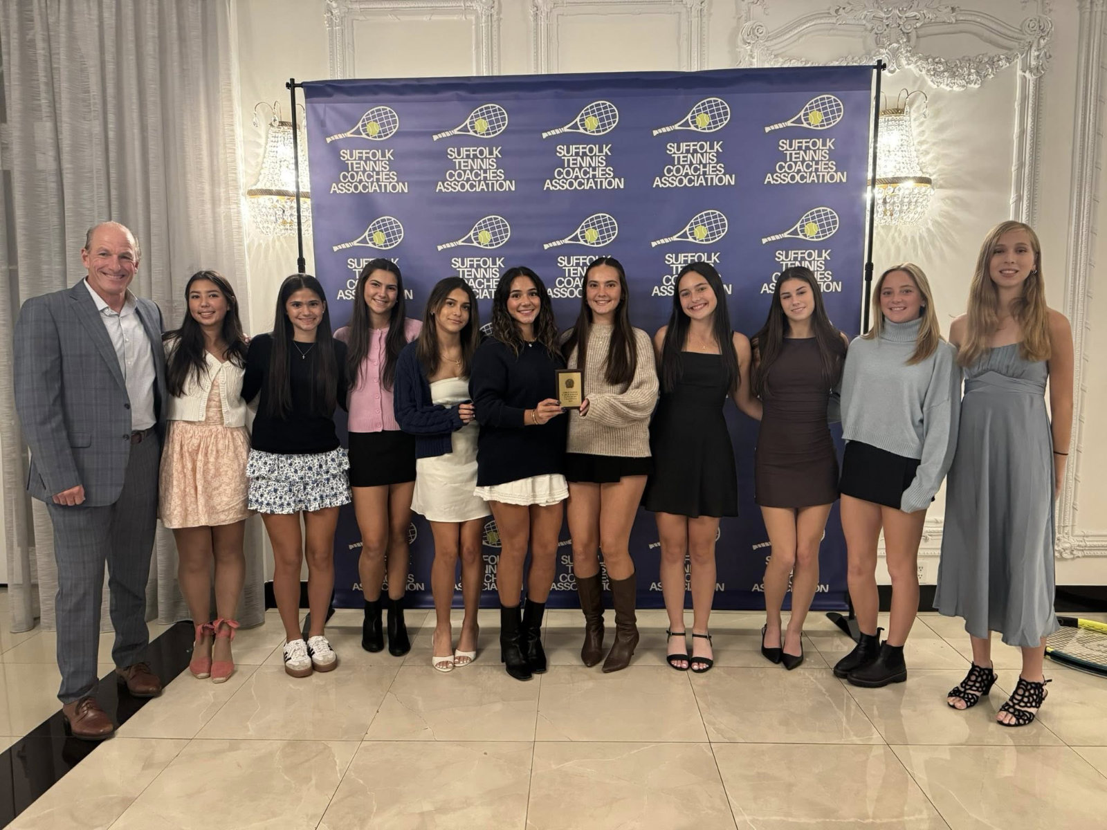  Coach Jamie Fishlow with the Suffolk tennis award recipients from Huntington.  