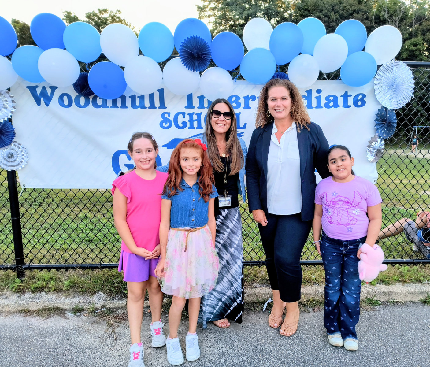  Principal Stephanie Campbell and Supt. Beth McCoy with students at the social.  