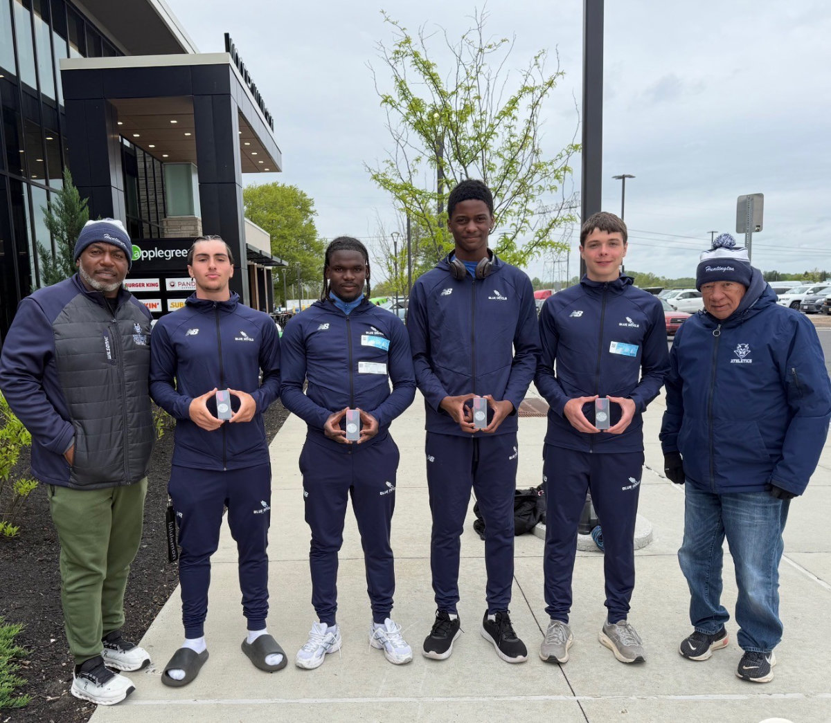  The Huntington 4x400 relay with coaches Ron Wilson and Eli Acosta.  