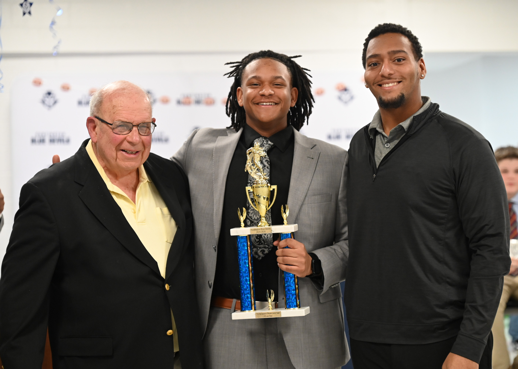  Jean Riboul is flanked by Pete Sansiviero and Dareus Smith at the football awards dinner    