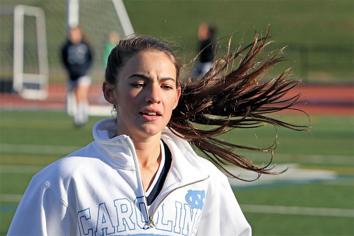 Courtney O'Bryan warms-up for a soccer game during her senior year. (Photo by Mike Connell.)