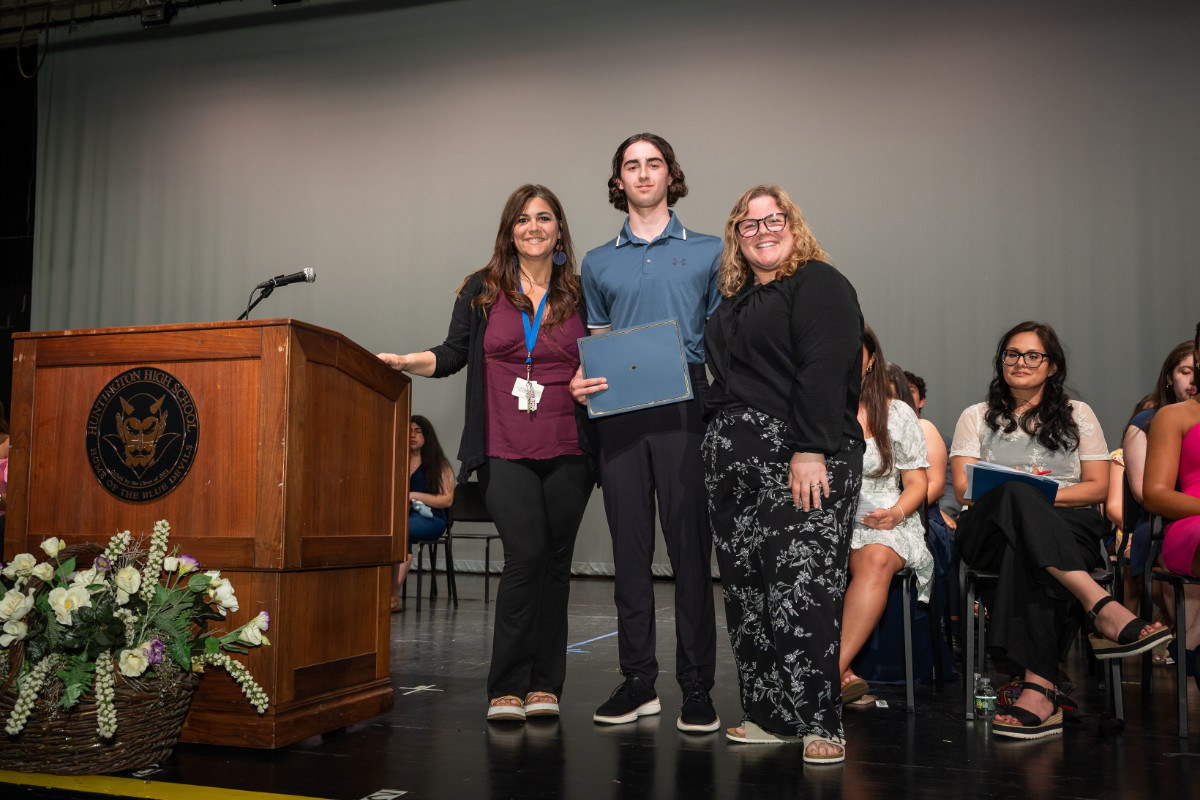  Spencer James with the National Honor Society faculty advisors. (Darin Reed photo.)  