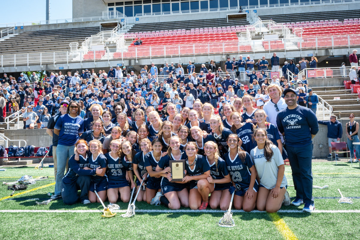 The Blue Devils celebrate with the county championship plaque. (Darin Reed photo.)
